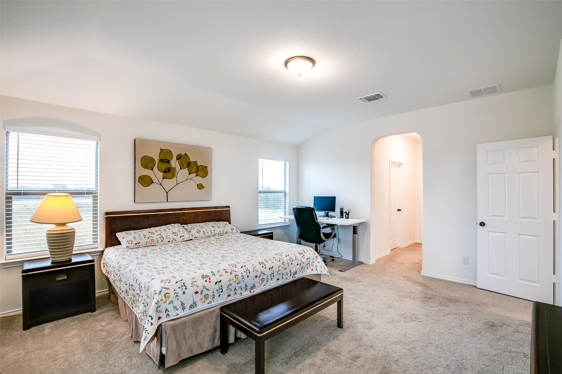 1924 Stringer Pass Leander, TX 78641 - Photo 22 of 34 a bedroom with a bed and dresser