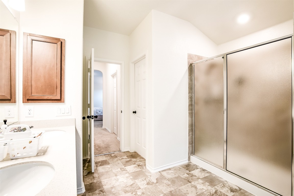 1924 Stringer Pass Leander, TX 78641 - Photo 25 of 34 a bathroom with a shower and a sink