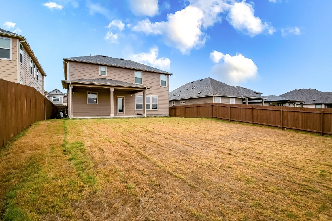 1924 Stringer Pass Leander, TX 78641 - Photo 31 of 34 a view of a house with a yard