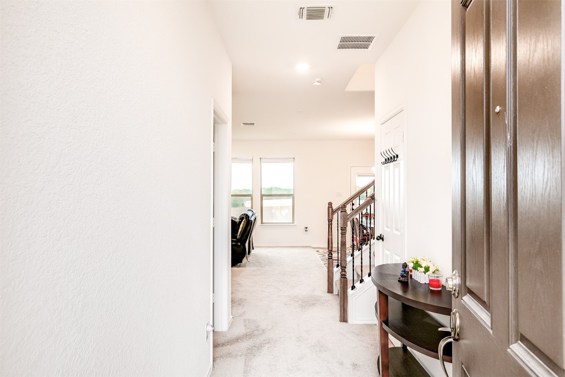 1924 Stringer Pass Leander, TX 78641 - Photo 4 of 34 a view of a hallway with seating area