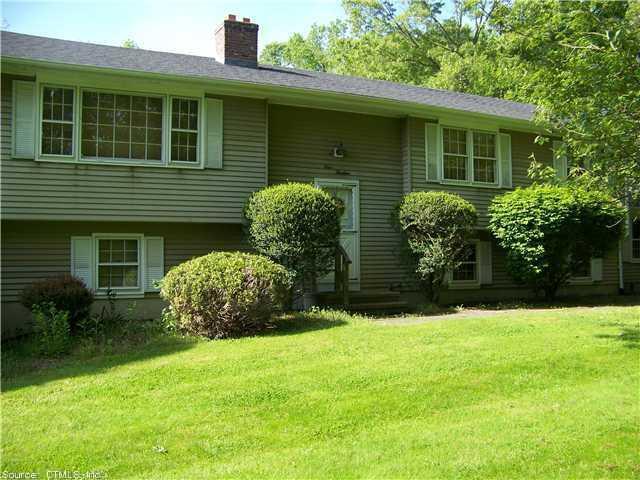 413 Green Hill Road Madison, CT 06443 - Photo 1 of 1 a front view of a house with garden