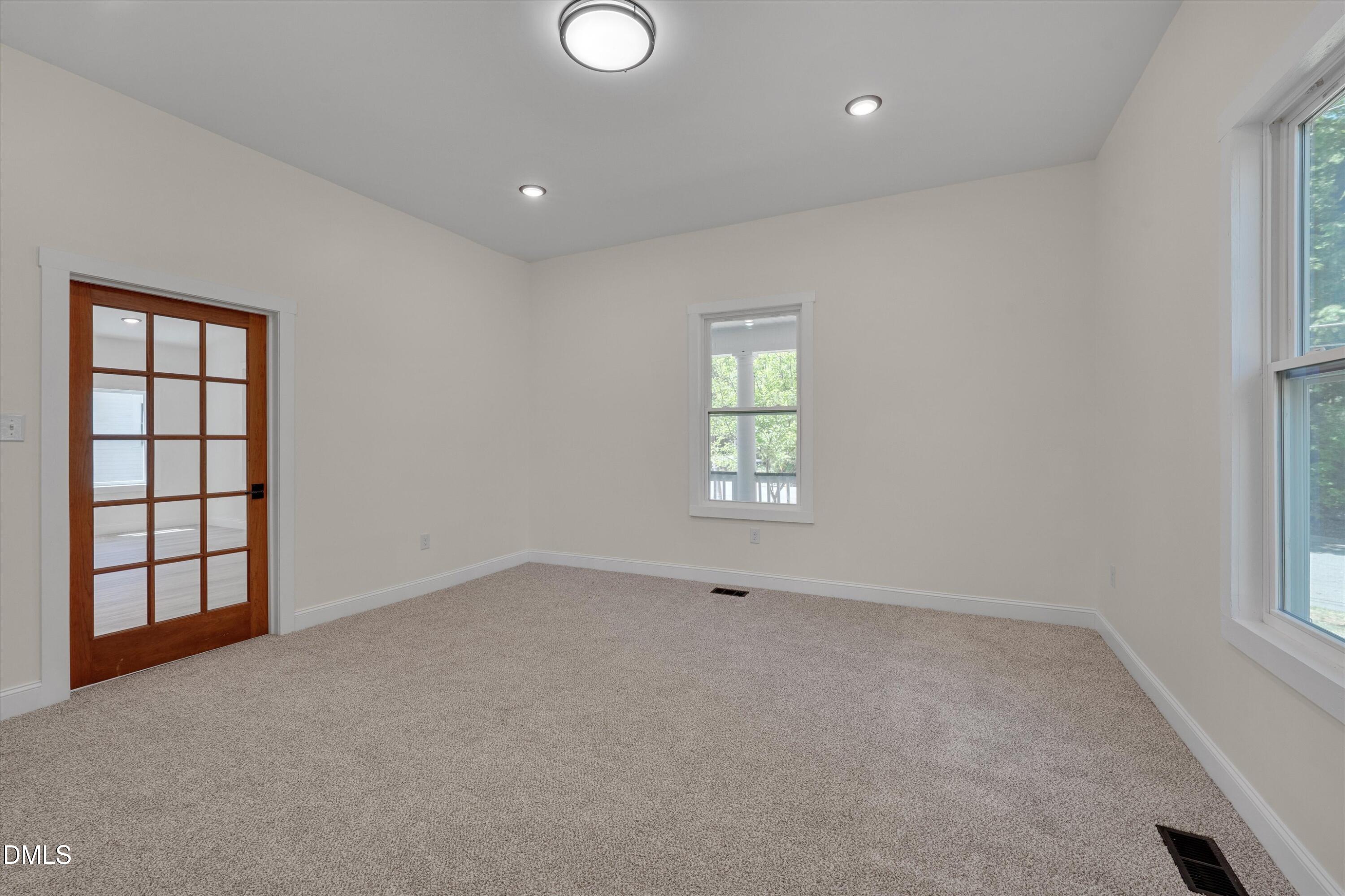 111 Virginia Avenue Roxboro, NC 27573 - Photo 11 of 42 an empty room with windows