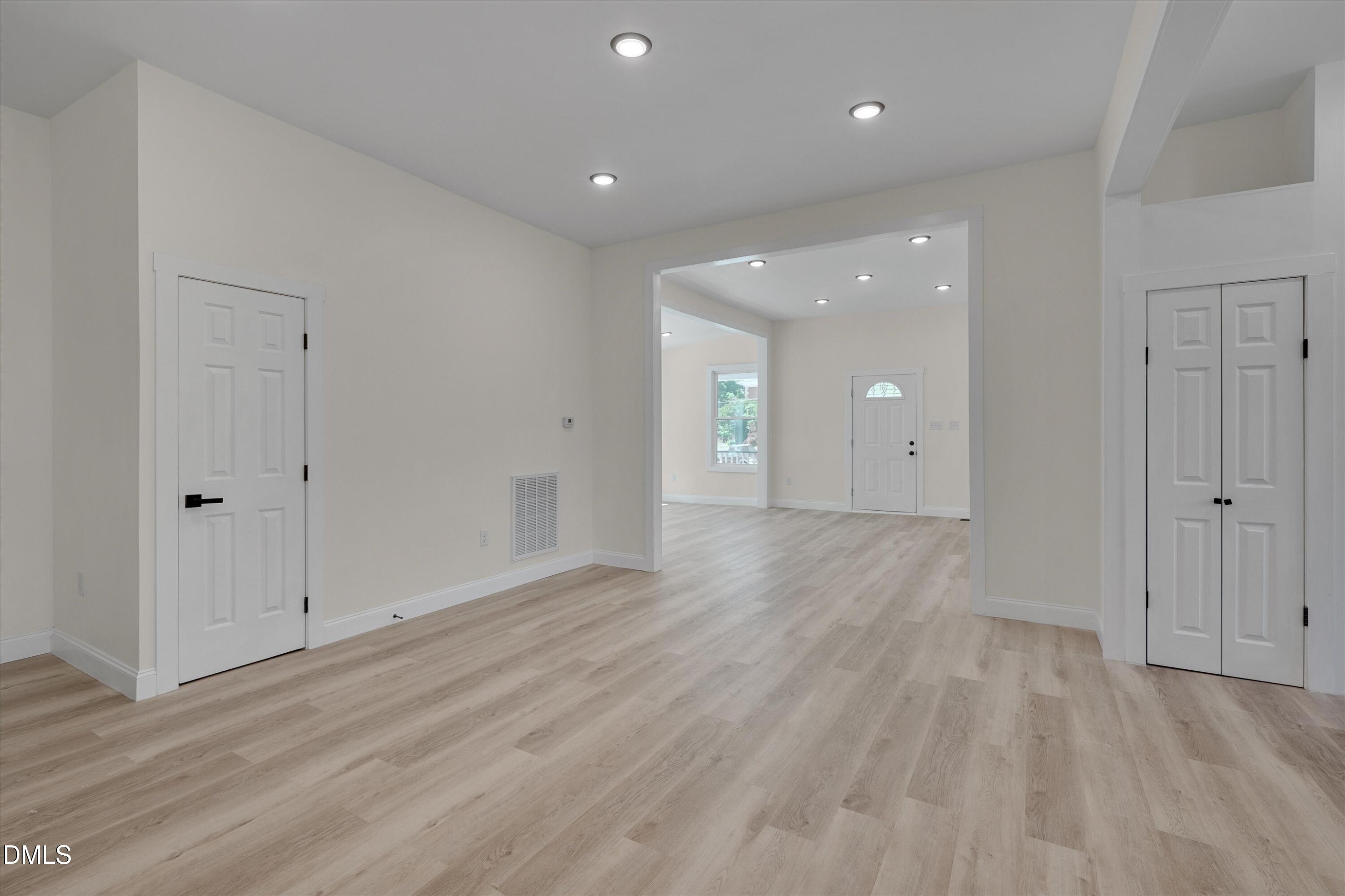 111 Virginia Avenue Roxboro, NC 27573 - Photo 13 of 42 a view of an empty room and wooden floor