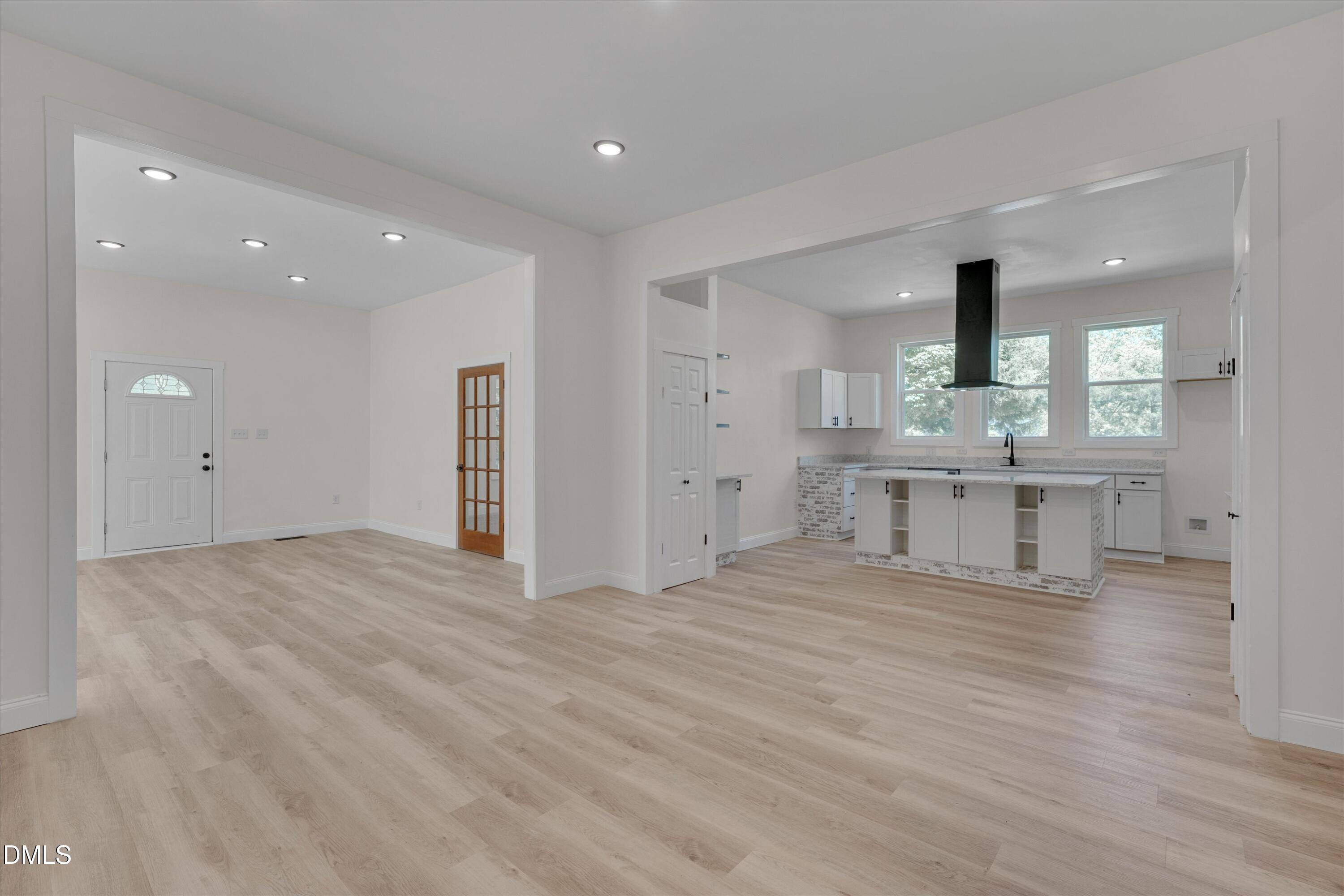 111 Virginia Avenue Roxboro, NC 27573 - Photo 15 of 42 a view of an empty room with a kitchen