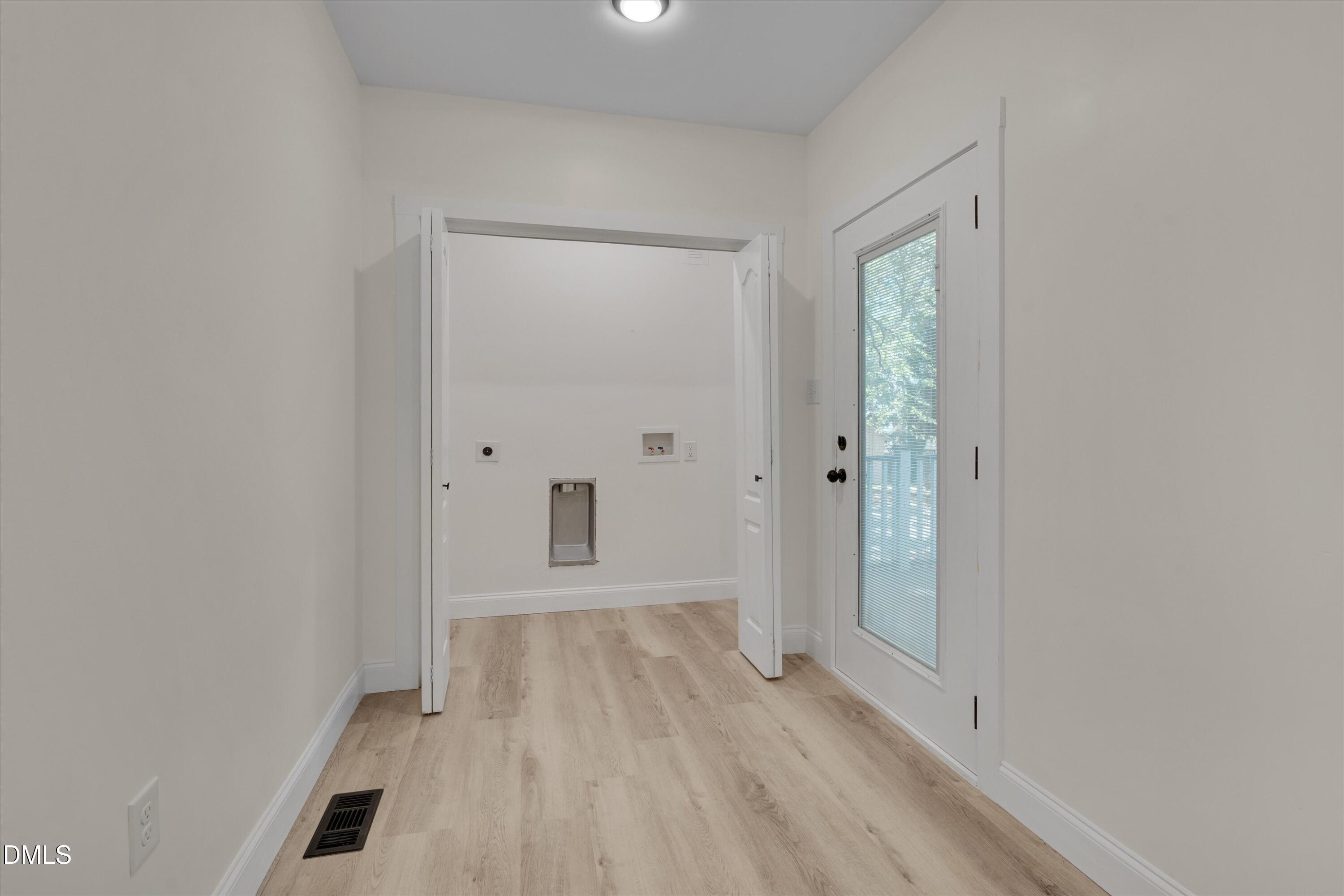111 Virginia Avenue Roxboro, NC 27573 - Photo 21 of 42 a view of an empty room with wooden floor