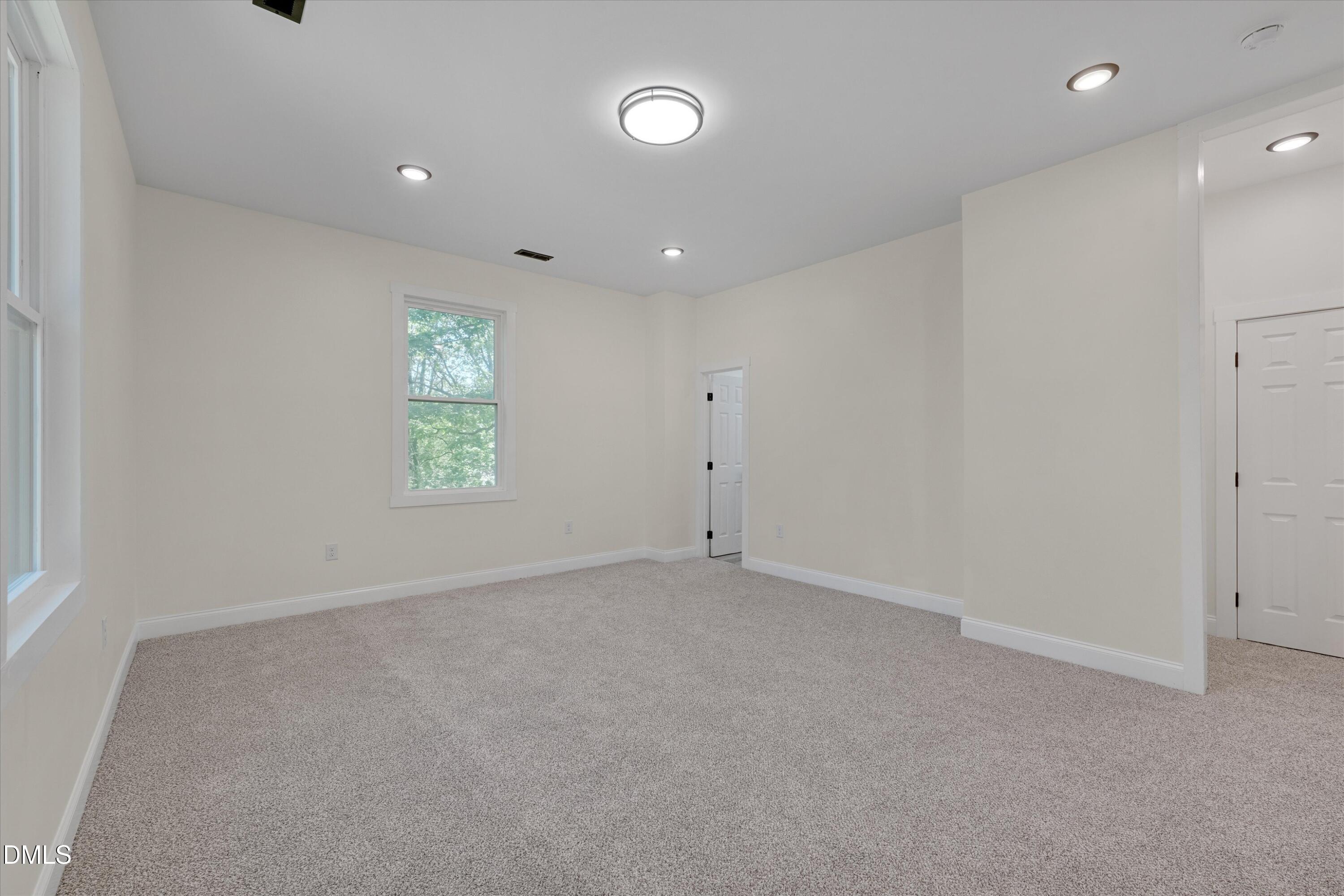 111 Virginia Avenue Roxboro, NC 27573 - Photo 27 of 42 an empty room with windows