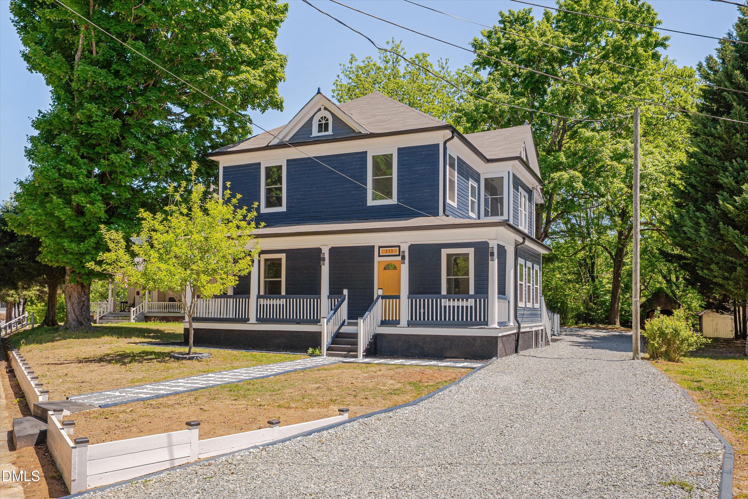 111 Virginia Avenue Roxboro, NC 27573 - Photo 2 of 42 a front view of a house with a yard