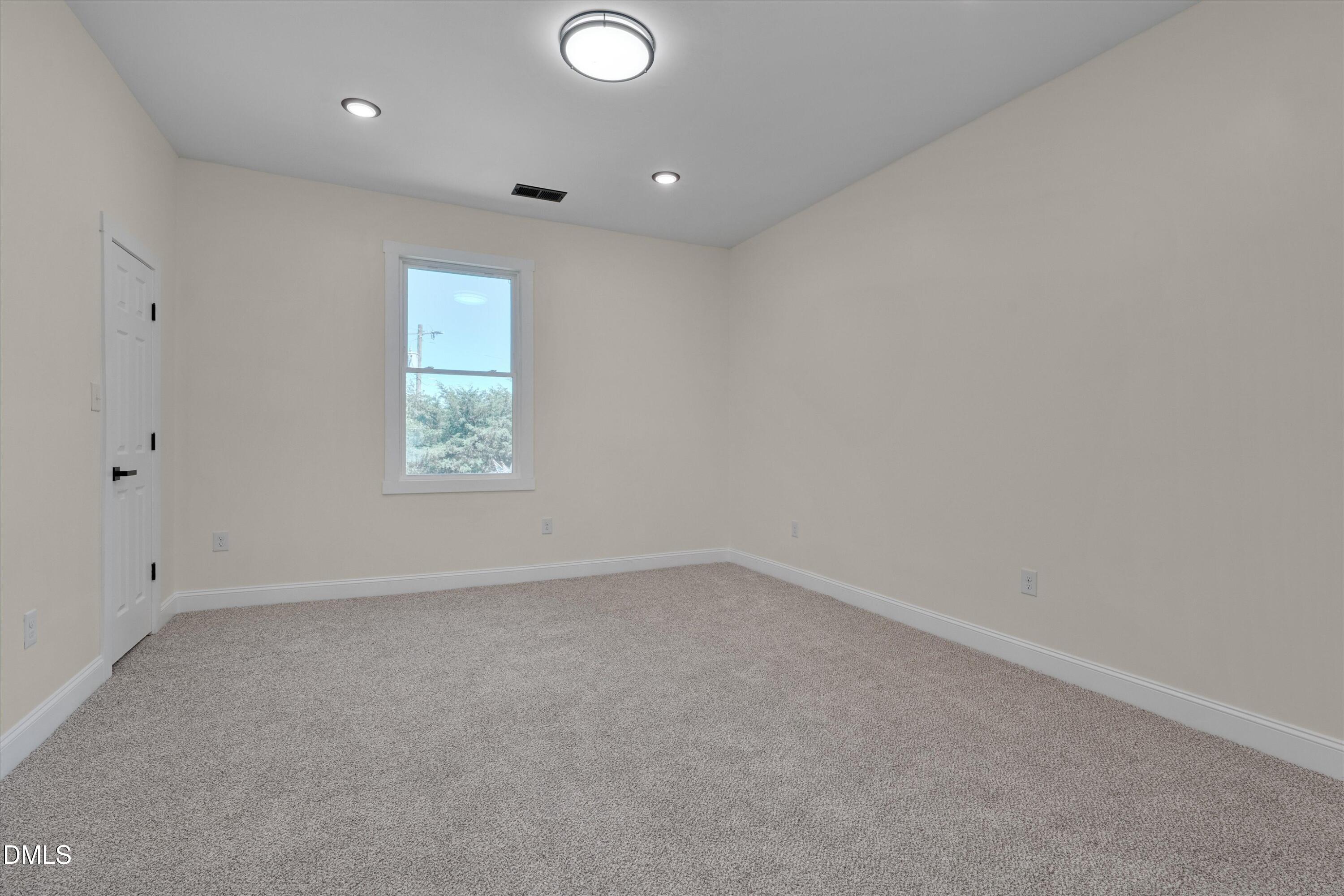 111 Virginia Avenue Roxboro, NC 27573 - Photo 30 of 42 an empty room with a window