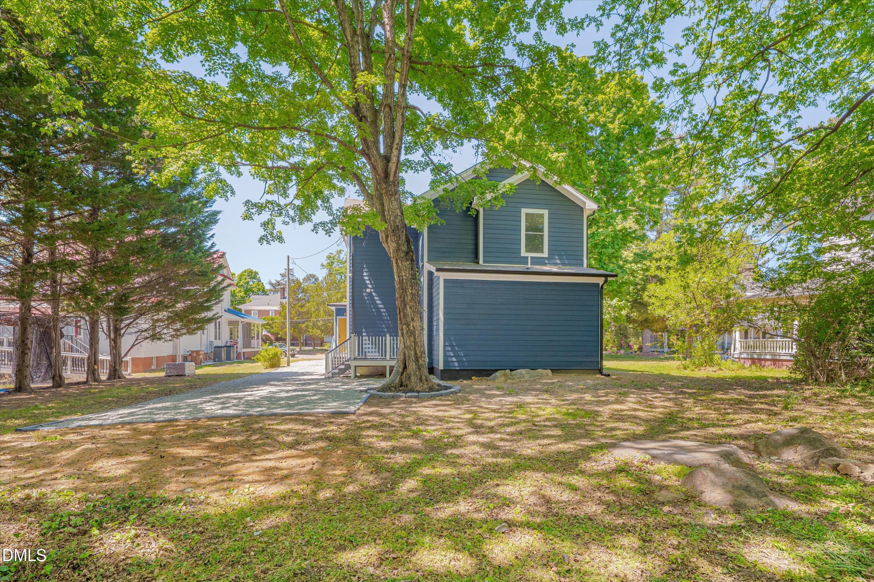 111 Virginia Avenue Roxboro, NC 27573 - Photo 40 of 42 a view of a house with a tree in front of it