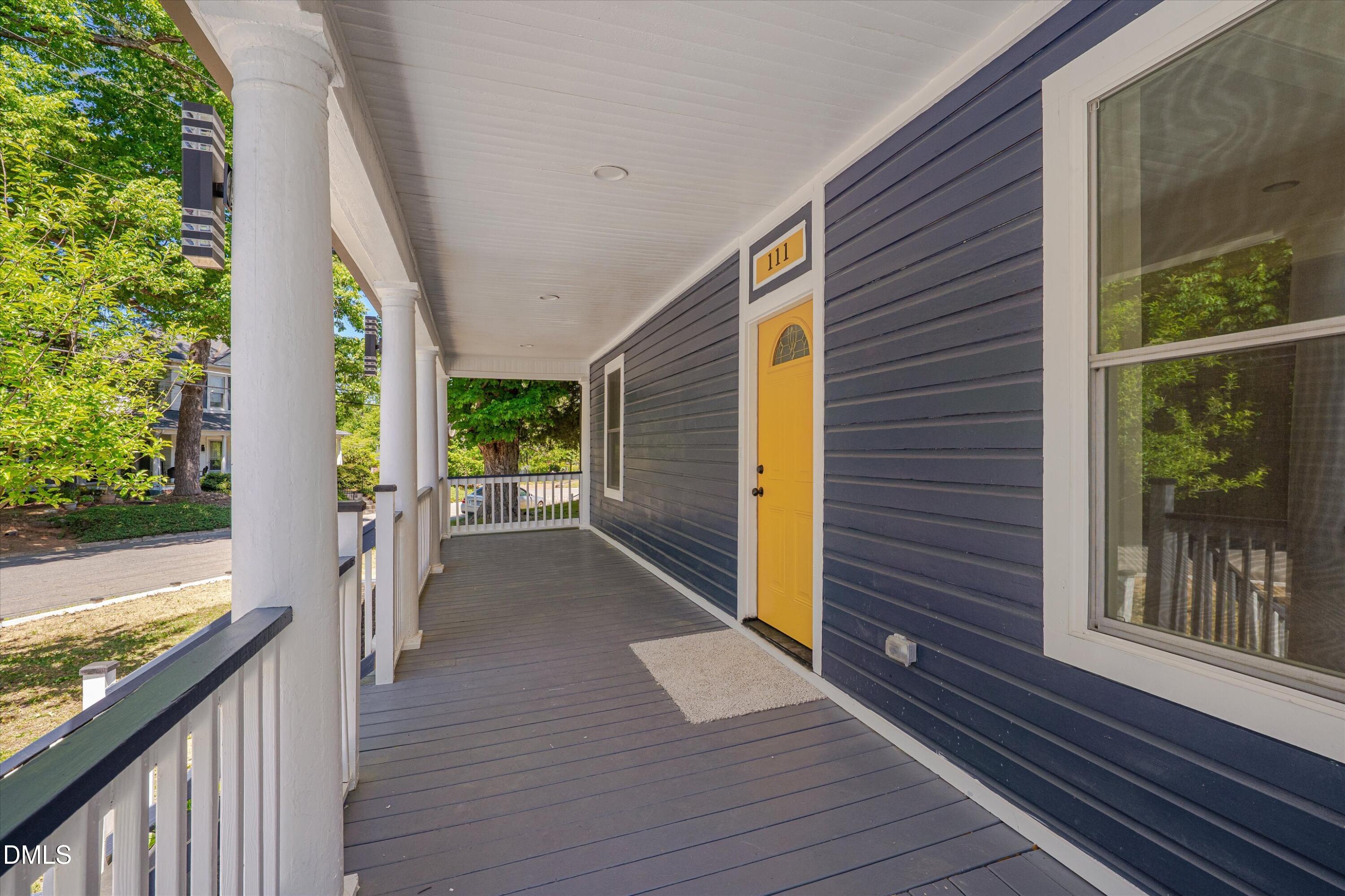 111 Virginia Avenue Roxboro, NC 27573 - Photo 4 of 42 a view of a house with porch and wooden floor