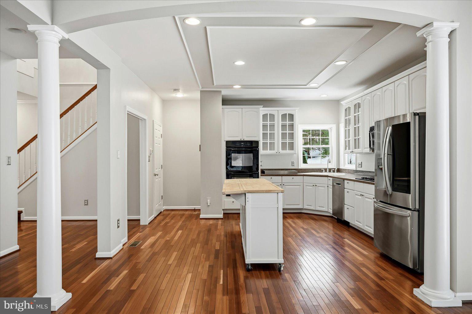 109 Waterside Lane Cross Junction, VA 22625 - Photo 11 of 107 a kitchen with white cabinets and stainless steel appliances