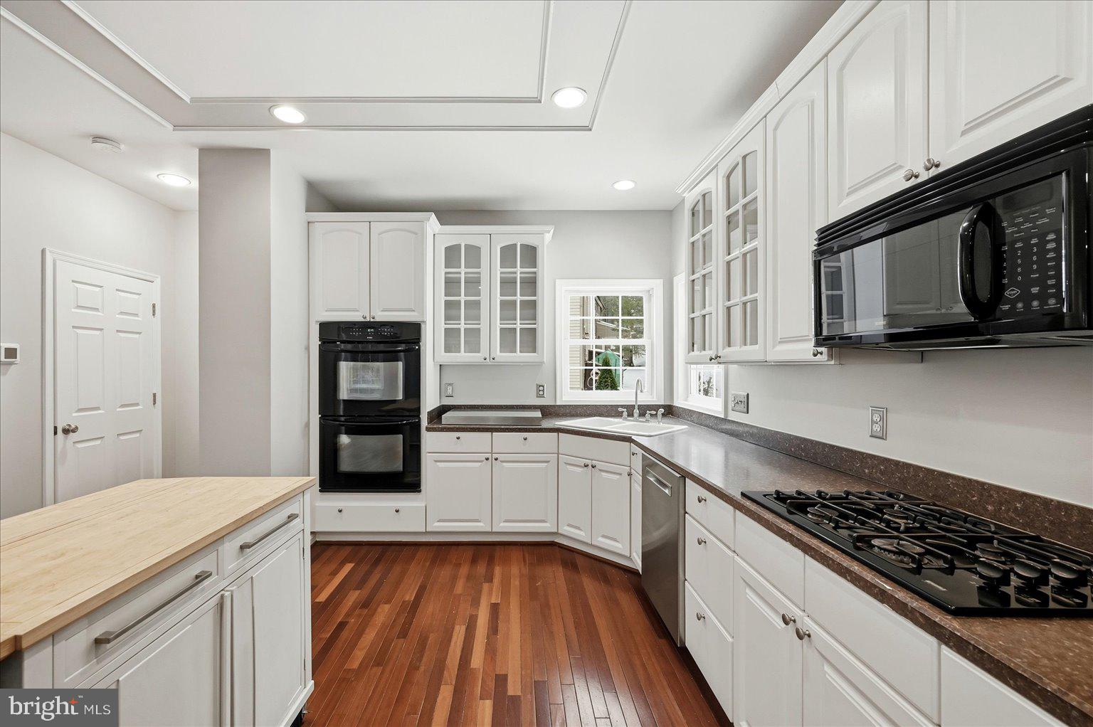 109 Waterside Lane Cross Junction, VA 22625 - Photo 12 of 107 a kitchen with stainless steel appliances granite countertop a stove and a microwave