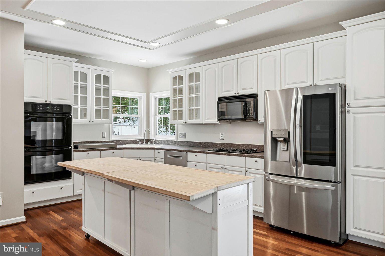 109 Waterside Lane Cross Junction, VA 22625 - Photo 15 of 107 a kitchen with stainless steel appliances granite countertop a stove and a refrigerator