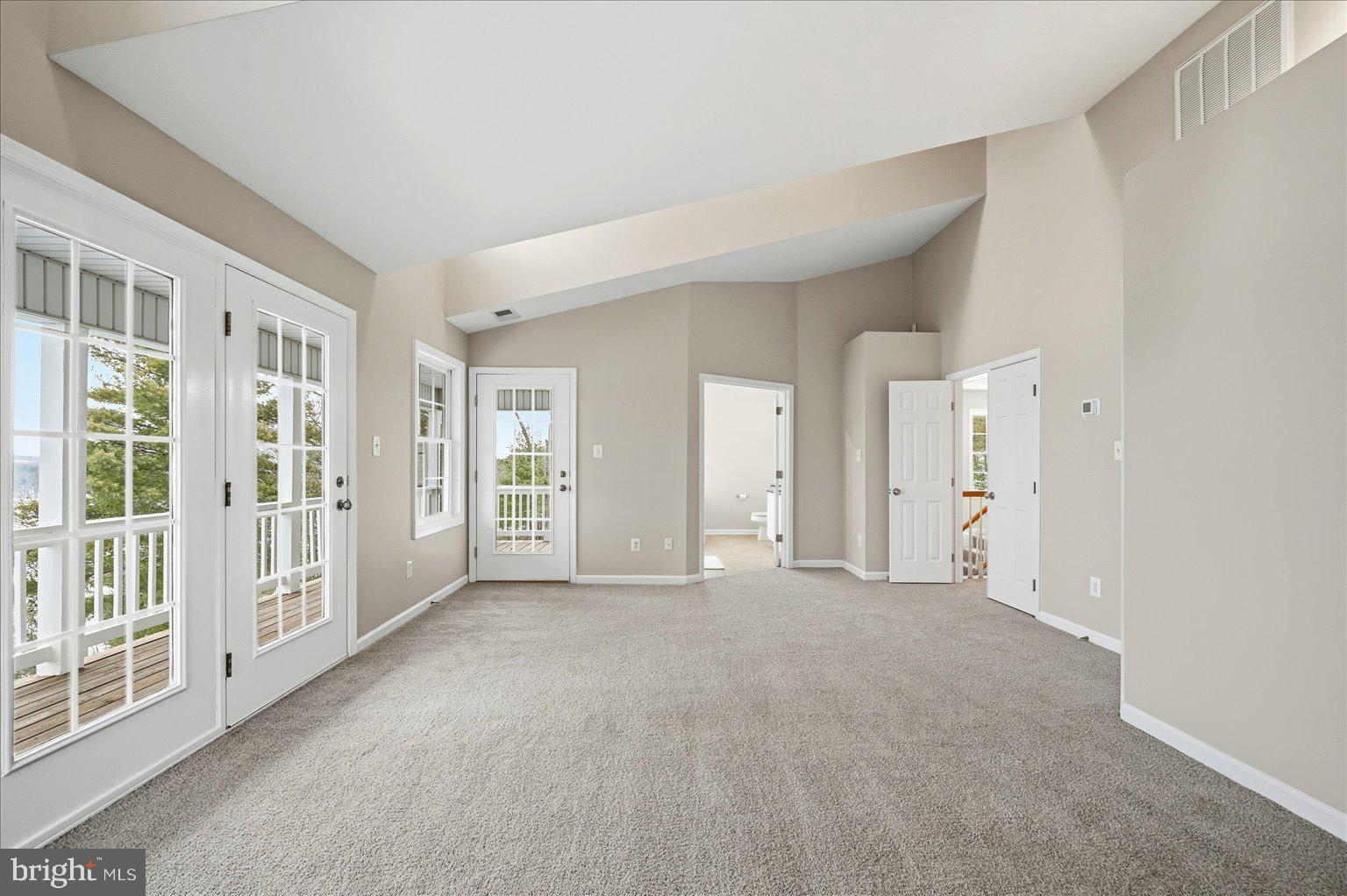 109 Waterside Lane Cross Junction, VA 22625 - Photo 33 of 107 a view of a big room with windows and chandelier fan