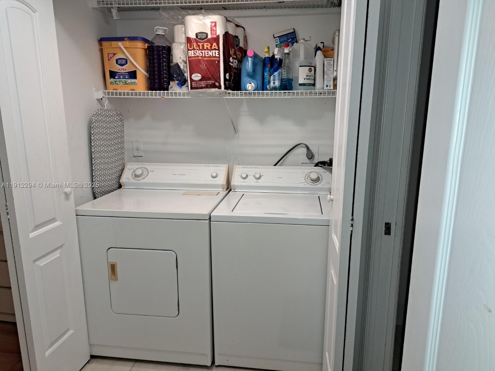 12136 St.Andrews Place, Unit 205 Miramar, FL 33025 - Photo 11 of 23 a utility room with dryer and washer