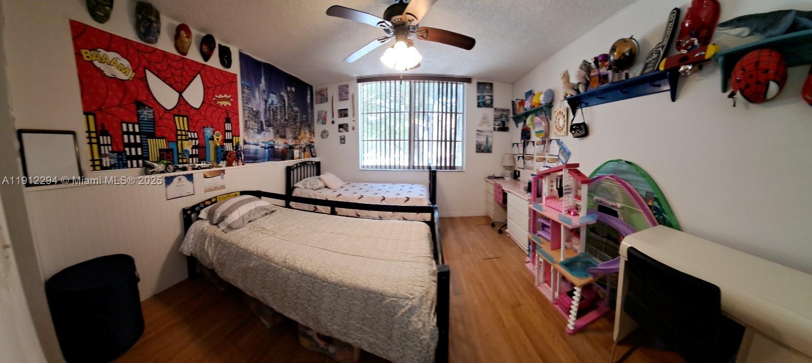 12136 St.Andrews Place, Unit 205 Miramar, FL 33025 - Photo 12 of 23 a bedroom with a bed and a window