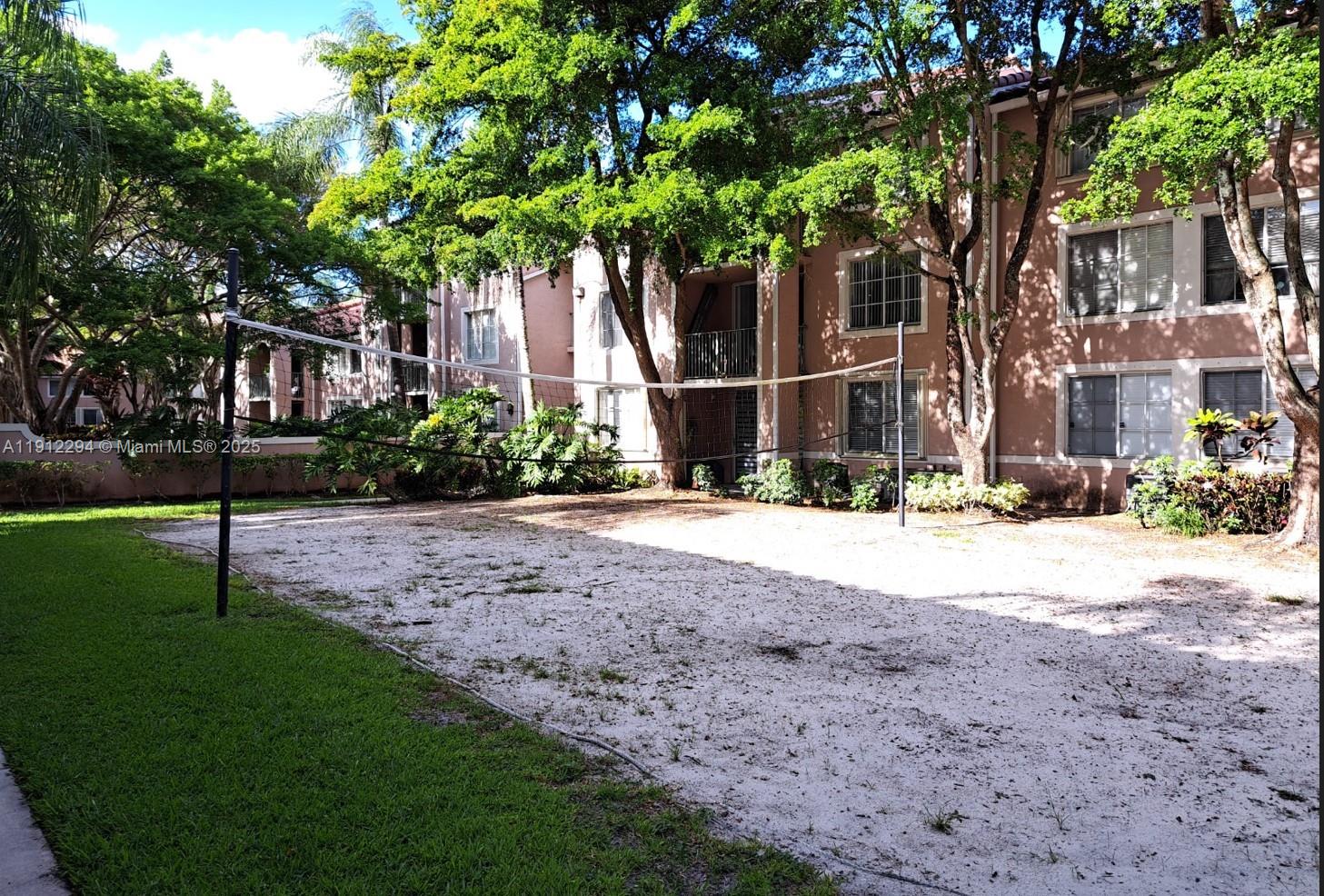 12136 St.Andrews Place, Unit 205 Miramar, FL 33025 - Photo 19 of 23 a view of a house with a tree in the background
