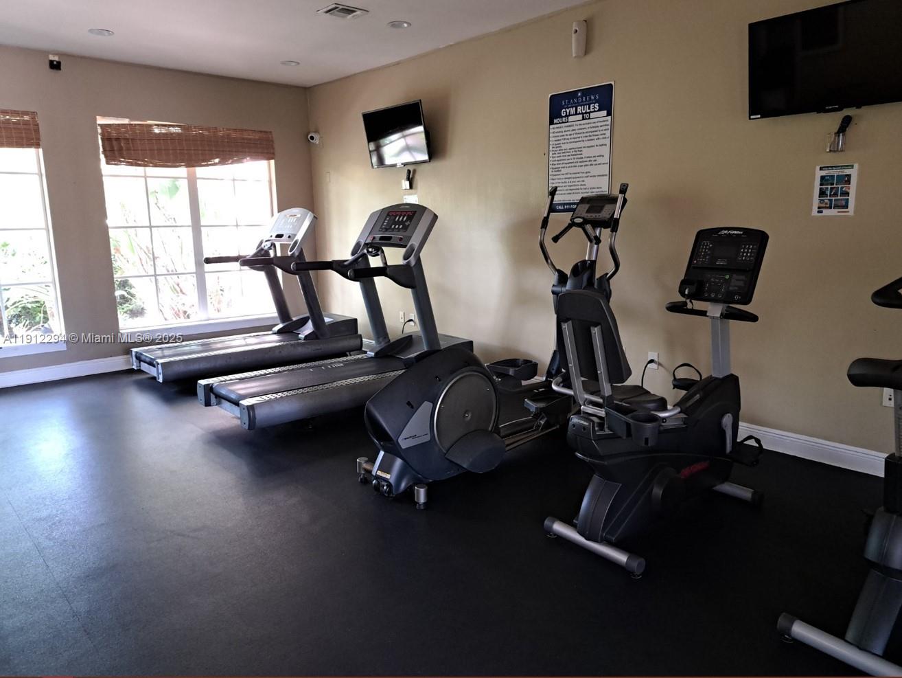 12136 St.Andrews Place, Unit 205 Miramar, FL 33025 - Photo 21 of 23 a view of a room with gym equipment