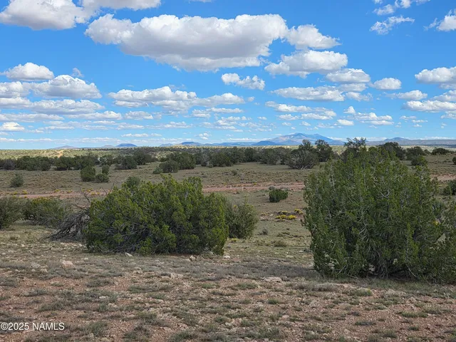 a view of a road with an outdoor seating