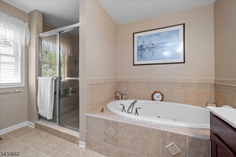 15 Bracken Hill Road Hamburg, NJ 07419 - Photo 23 of 44 a bathroom with a bathtub and a shower