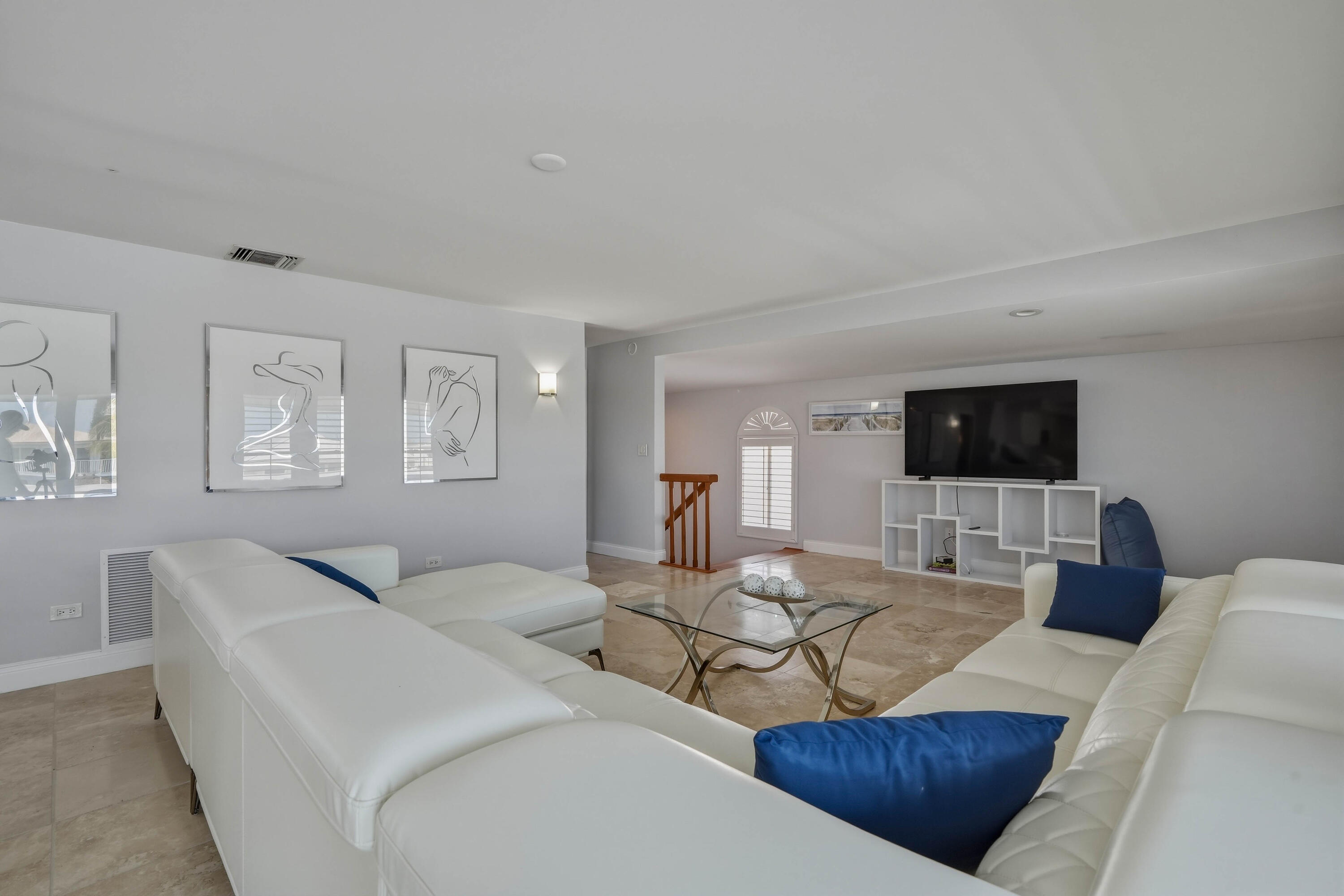 320 5th Street Key Colony Beach, FL 33051 - Photo 13 of 53 a living room with furniture a flat screen tv and a window
