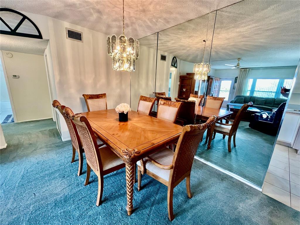 2403 Finlandia Lane, Unit 57 Clearwater, FL 33763 - Photo 4 of 41 a view of a dining room with furniture
