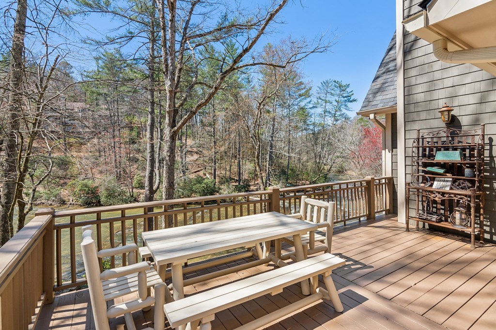 124 River Shoals Road Ellijay, GA 30536 - Photo 17 of 57 a view of a roof deck with wooden floor and fence