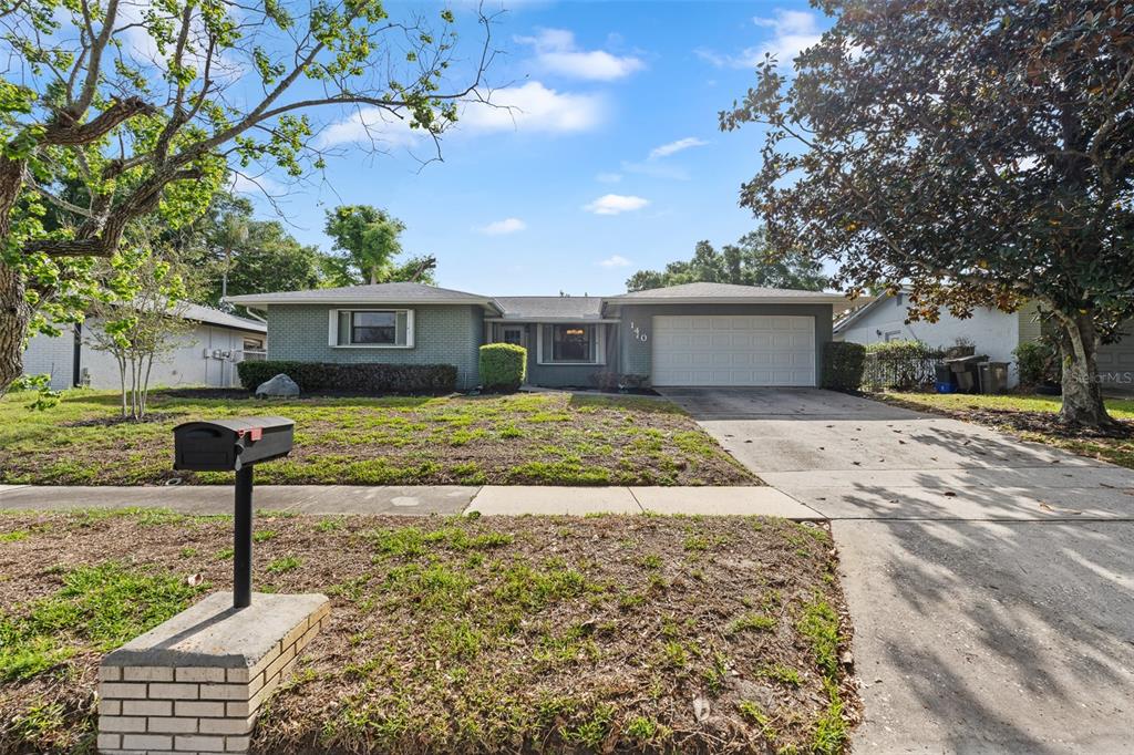 140 Valley Circle Brandon, FL 33510 - Photo 1 of 48 a front view of a house with garden