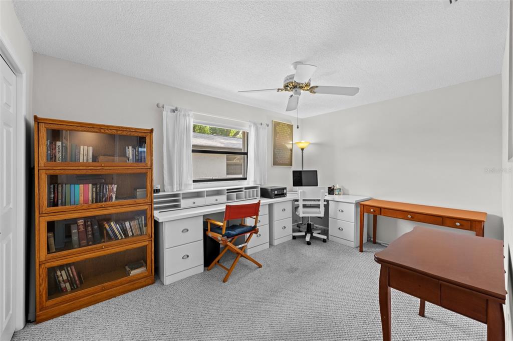 140 Valley Circle Brandon, FL 33510 - Photo 28 of 48 a view of a workspace with furniture and a window