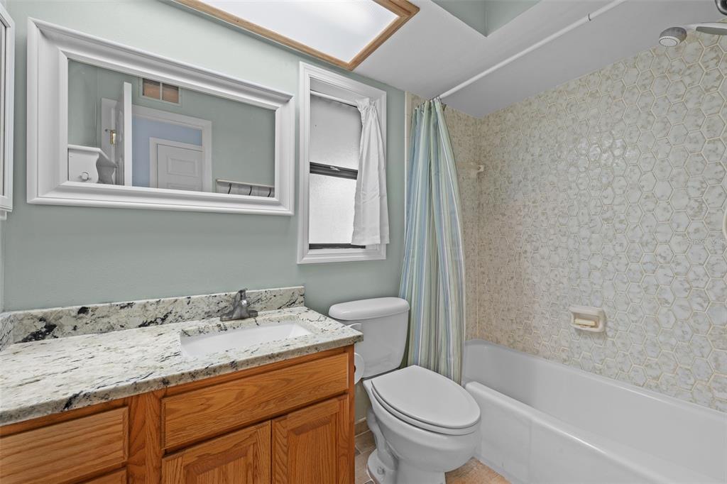 140 Valley Circle Brandon, FL 33510 - Photo 30 of 48 a bathroom with a granite countertop sink toilet and shower