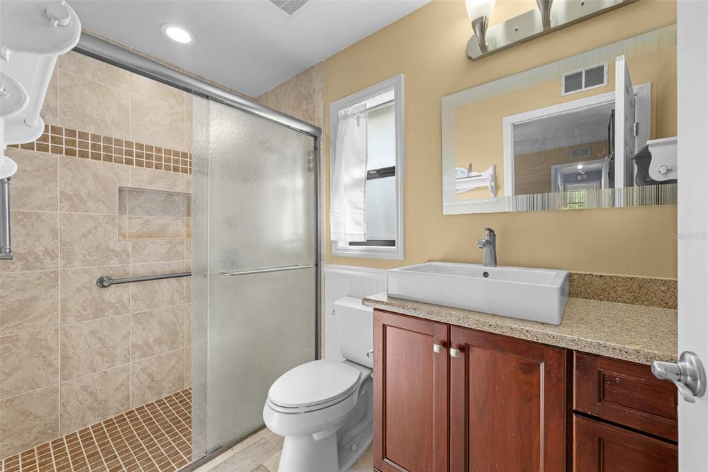 140 Valley Circle Brandon, FL 33510 - Photo 34 of 48 a bathroom with a granite countertop sink toilet and shower