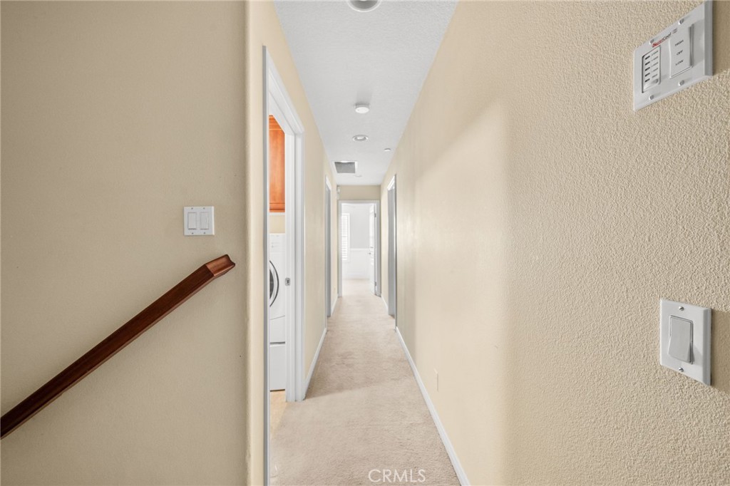 43 Three Vines Court Ladera Ranch, CA 92694 - Photo 20 of 42 a view of a hallway with a white walls