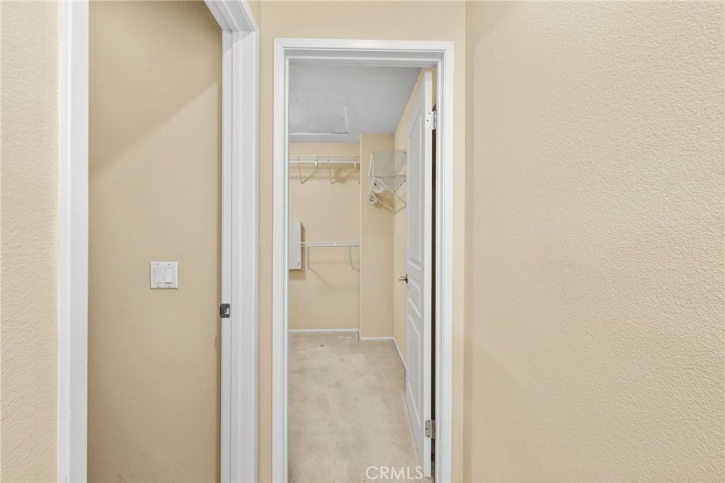 43 Three Vines Court Ladera Ranch, CA 92694 - Photo 27 of 42 a view of a bathroom from a hallway