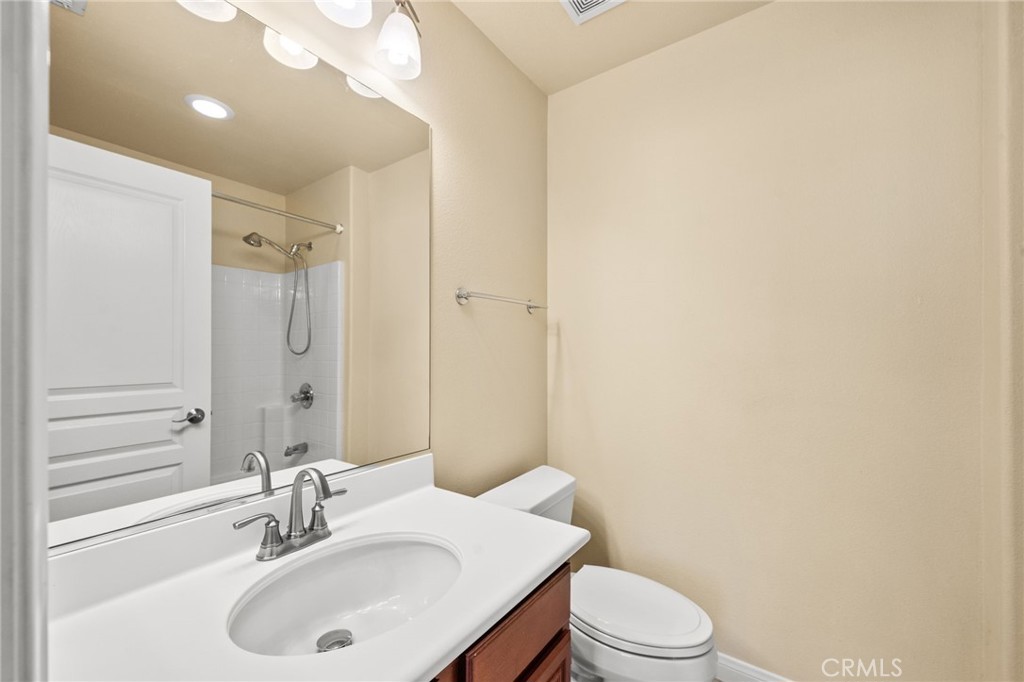 43 Three Vines Court Ladera Ranch, CA 92694 - Photo 32 of 42 a bathroom with a sink a toilet and shower