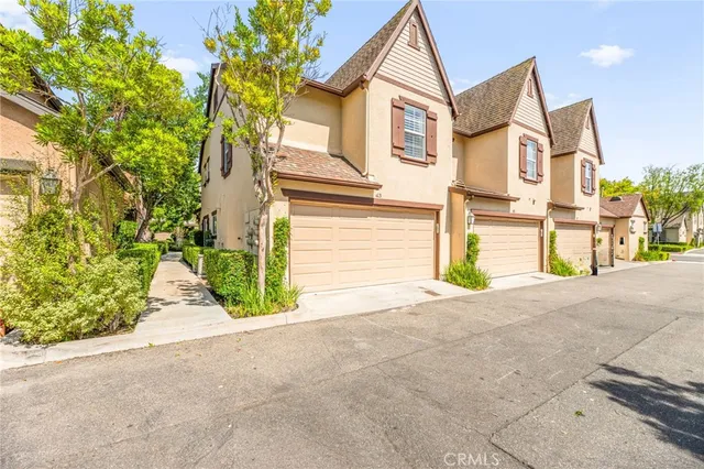 a view of a house with a yard and garage