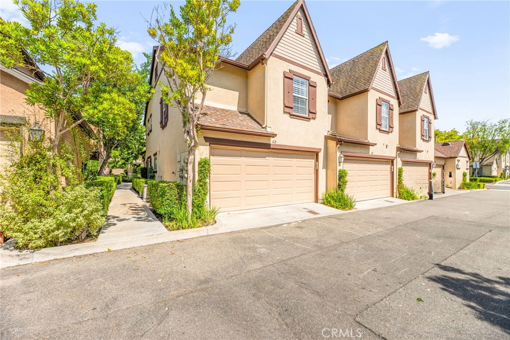 43 Three Vines Court Ladera Ranch, CA 92694 - Photo 7 of 42 a view of a house with a street and a garage