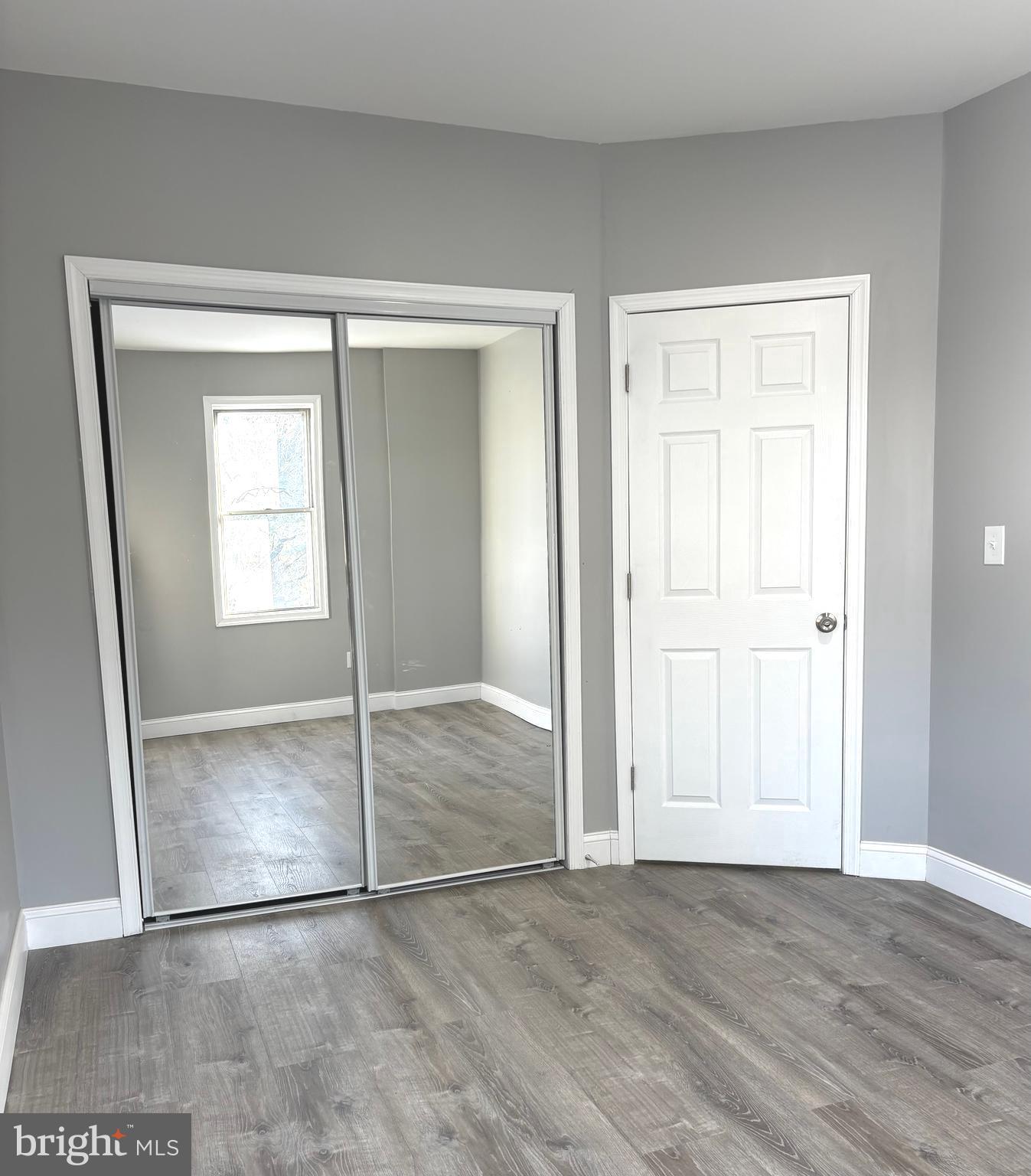 11890 Bustleton Avenue Philadelphia, PA 19116 - Photo 4 of 12 an empty room with window and mirror