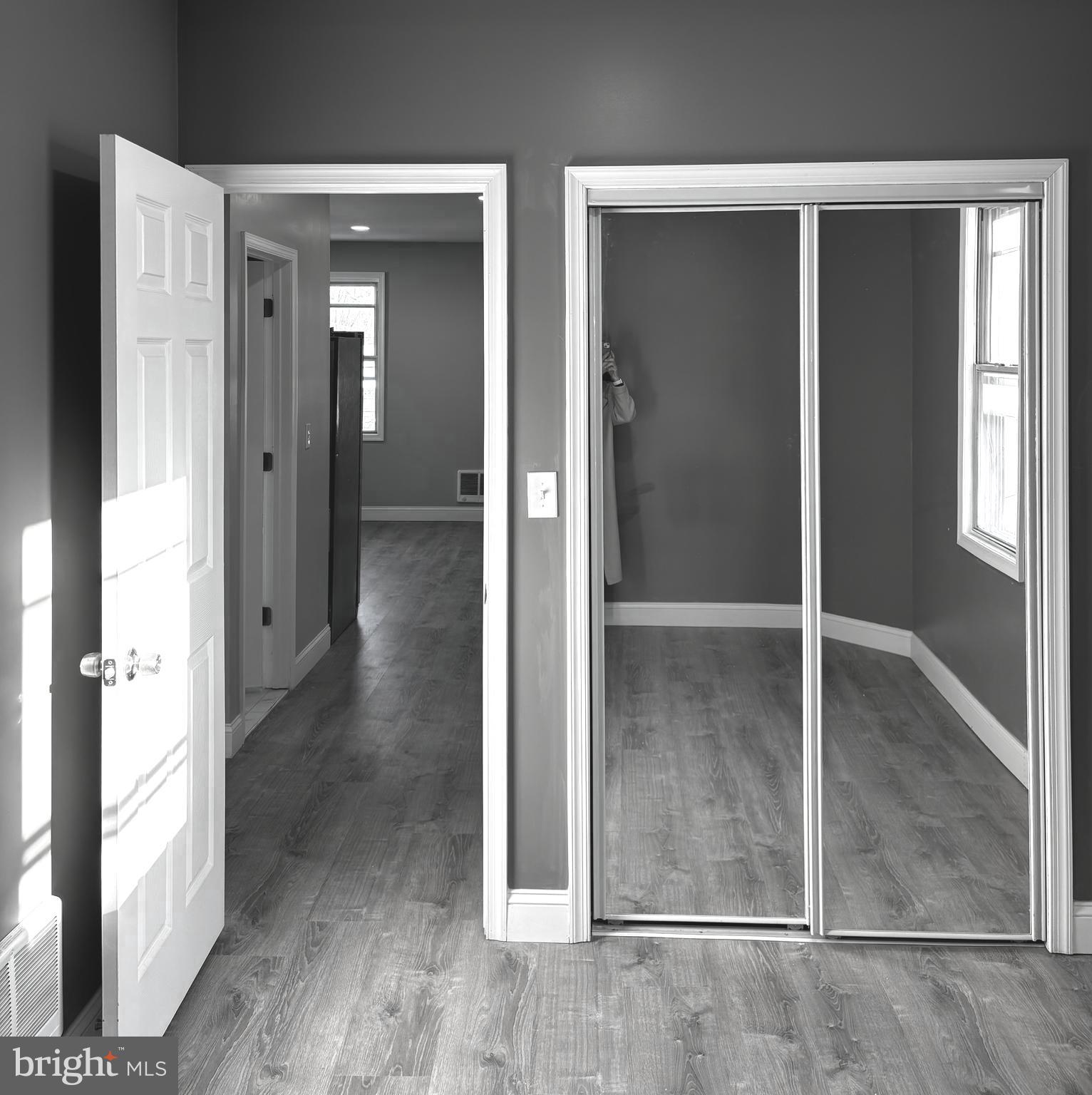 11890 Bustleton Avenue Philadelphia, PA 19116 - Photo 5 of 12 an empty room with wooden floor and windows