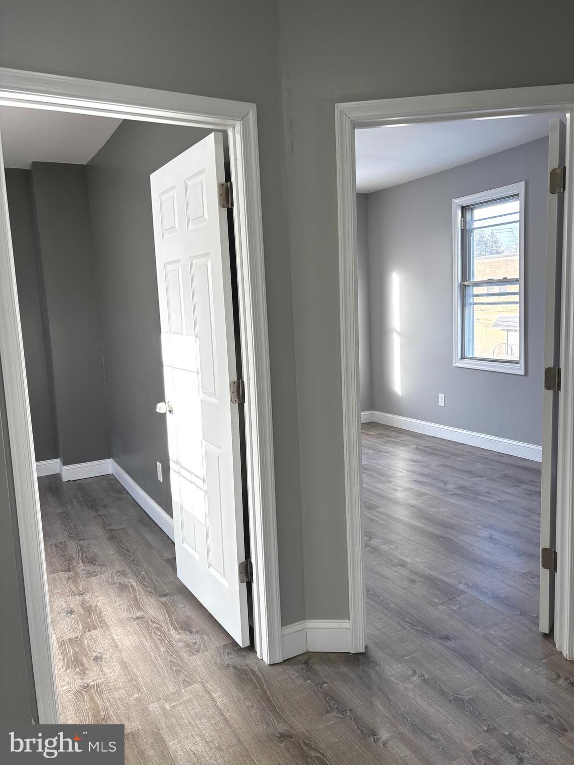 11890 Bustleton Avenue Philadelphia, PA 19116 - Photo 6 of 12 an empty room with wooden floor and windows