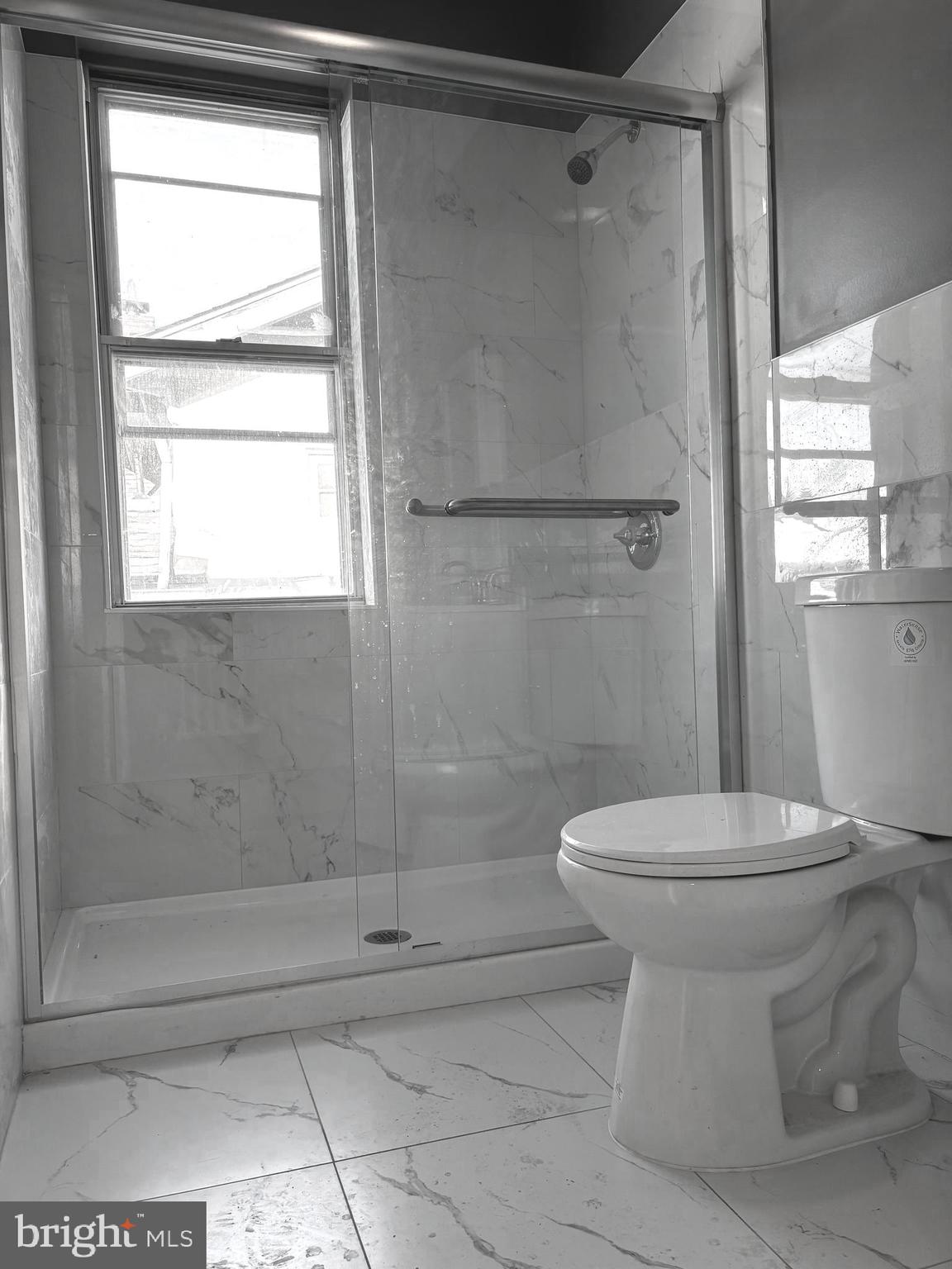 11890 Bustleton Avenue Philadelphia, PA 19116 - Photo 7 of 12 a bathroom with a toilet and a shower