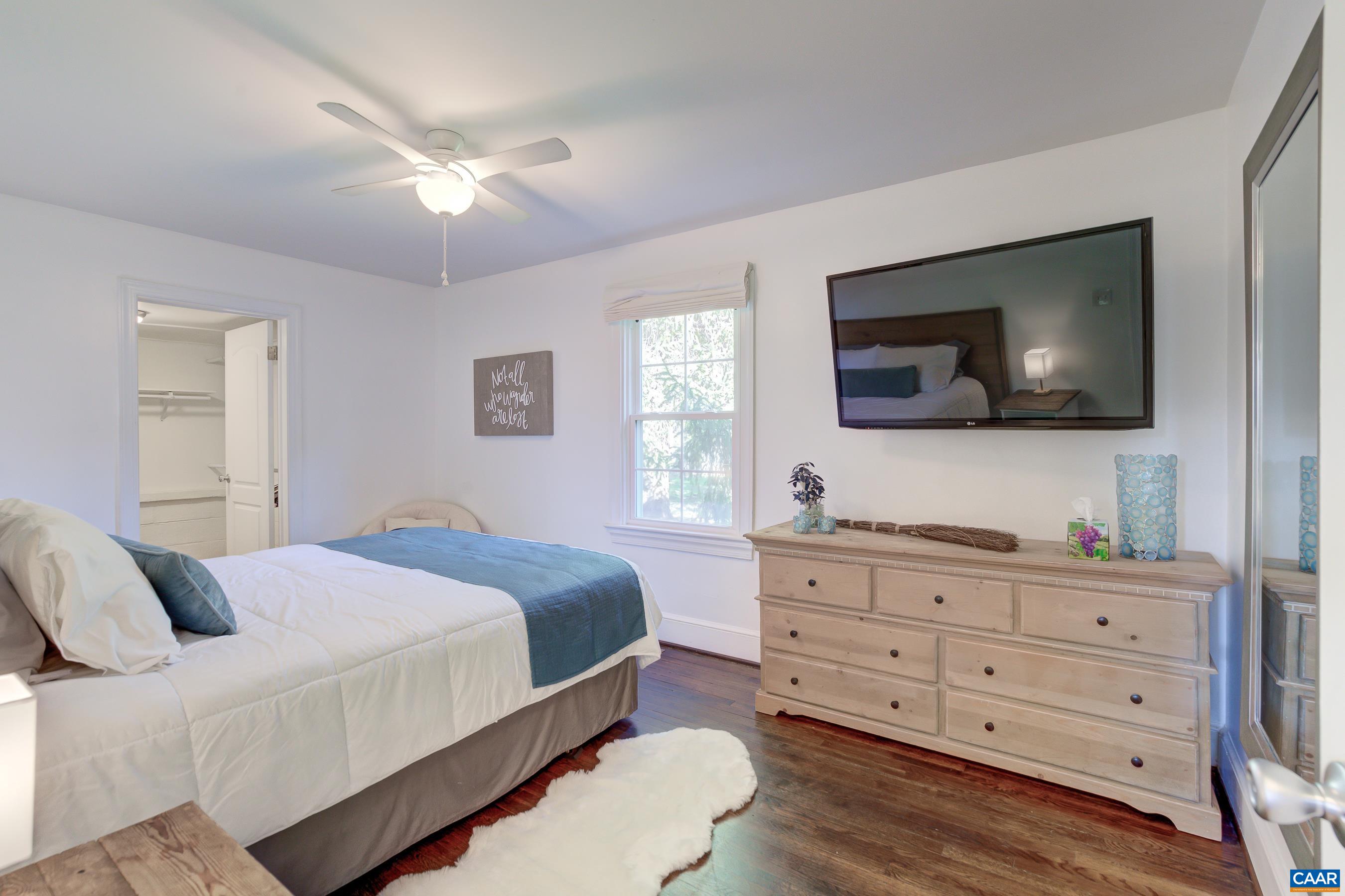 2974 Milton Road Charlottesville, VA 22902 - Photo 20 of 50 a bedroom with a bed and a flat screen tv