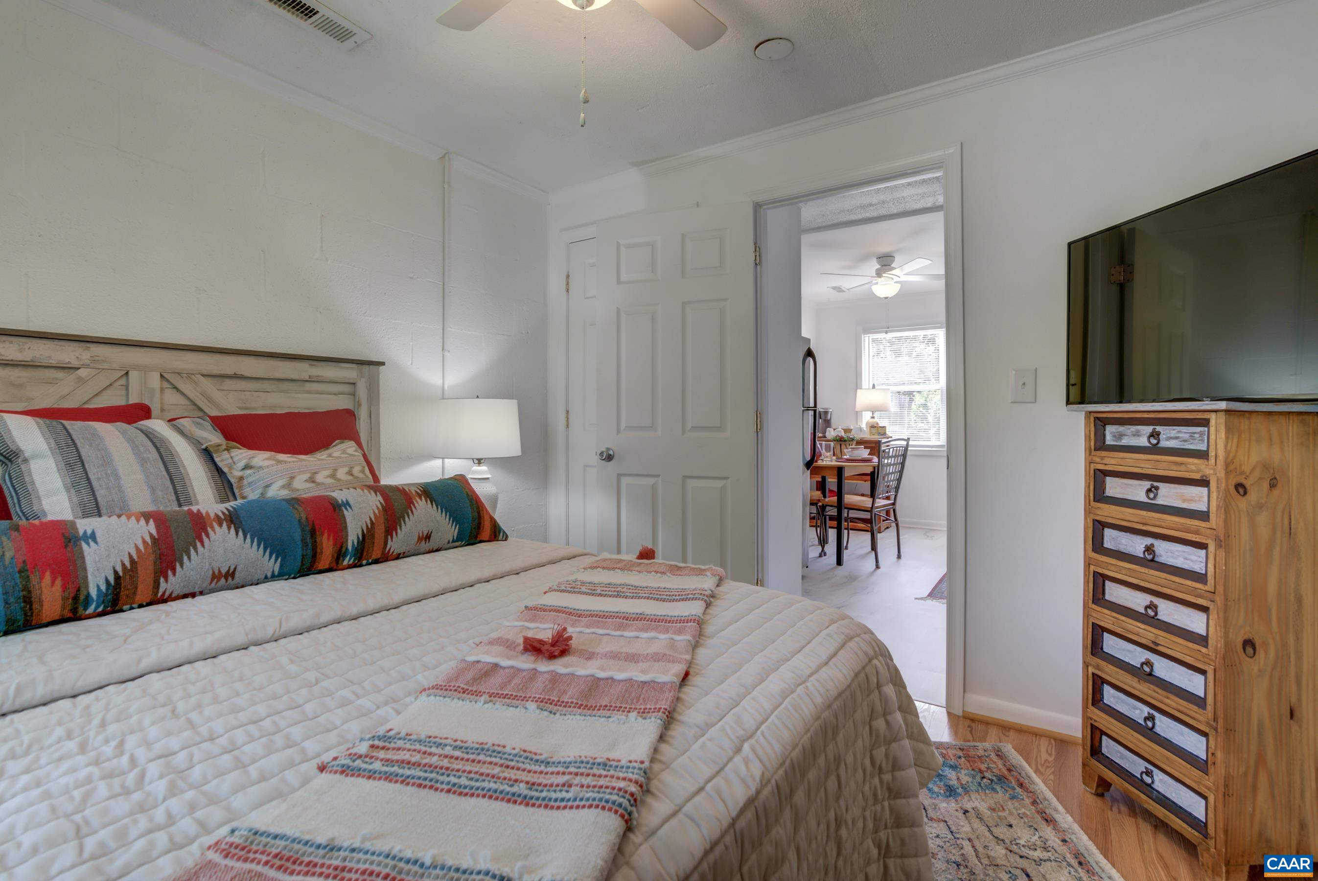 2974 Milton Road Charlottesville, VA 22902 - Photo 32 of 50 a bedroom with a bed and a flat screen tv