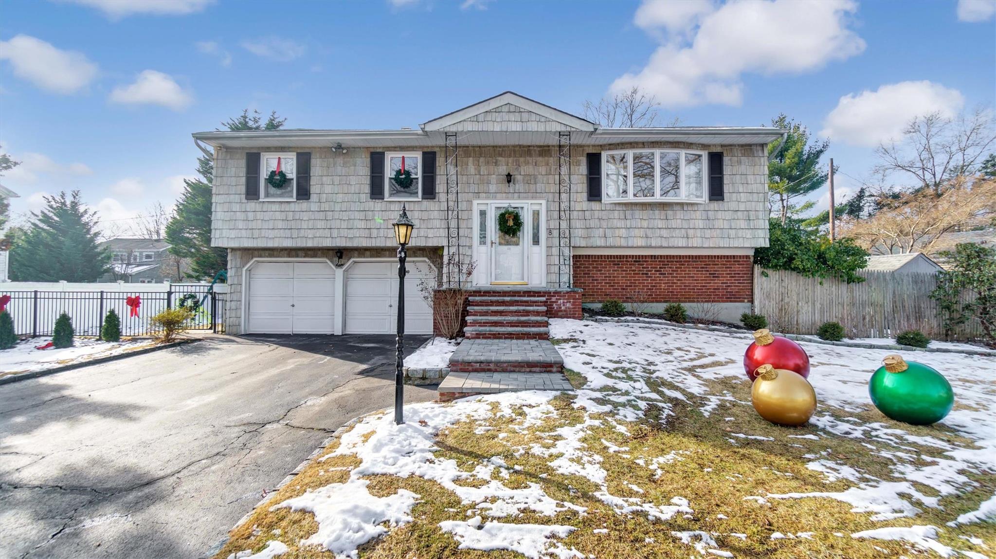 8 Frost Pond Road Greenlawn, NY 11740 - Photo 1 of 1 a front view of a house with a yard
