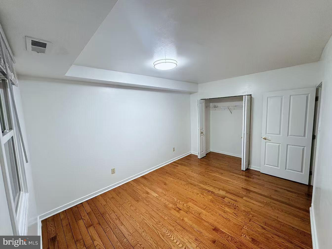 304 North 8th Street Philadelphia, PA 19123 - Photo 13 of 16 a view of an empty room with wooden floor
