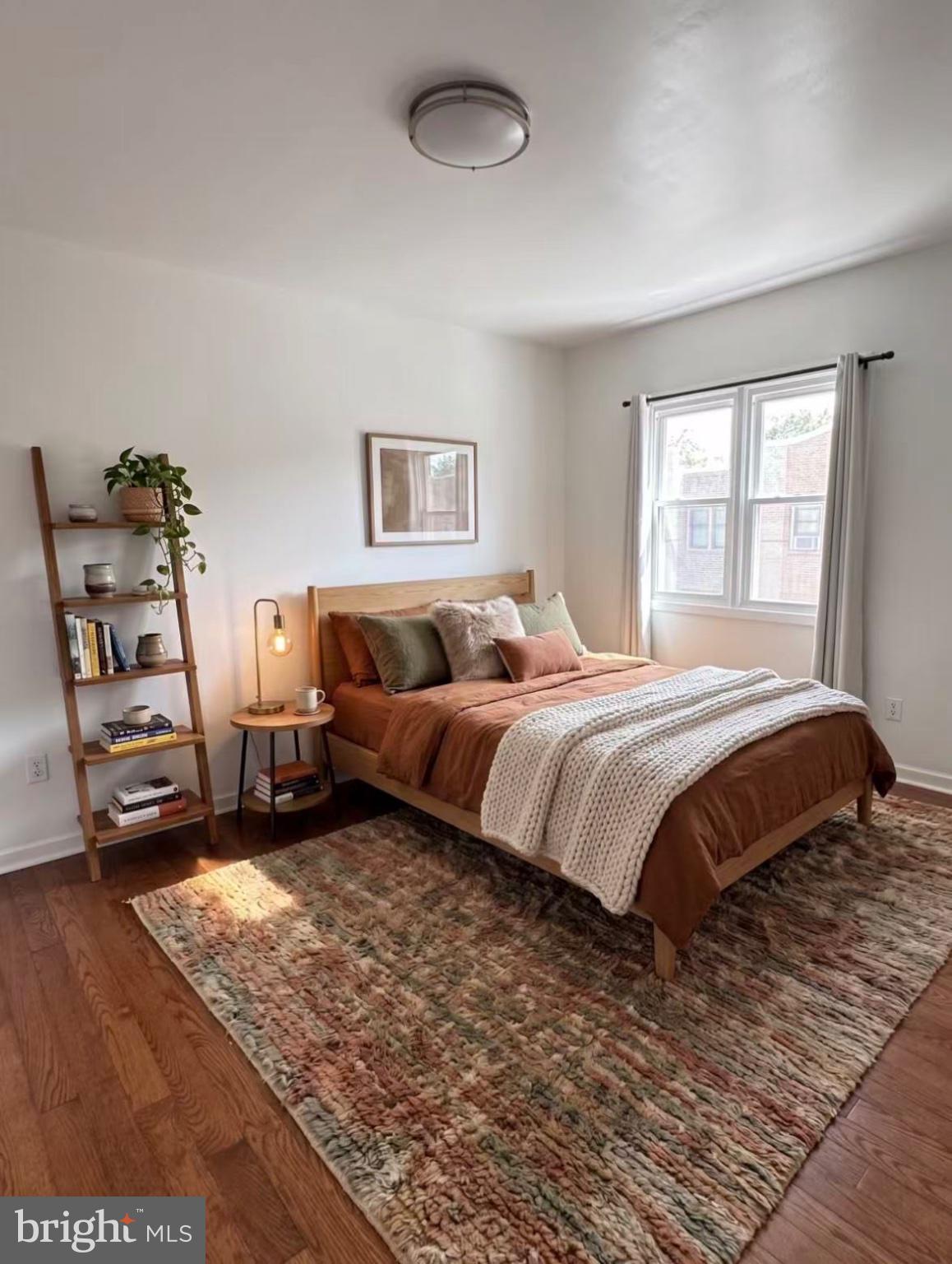 304 North 8th Street Philadelphia, PA 19123 - Photo 2 of 16 a bedroom with a bed and a dresser