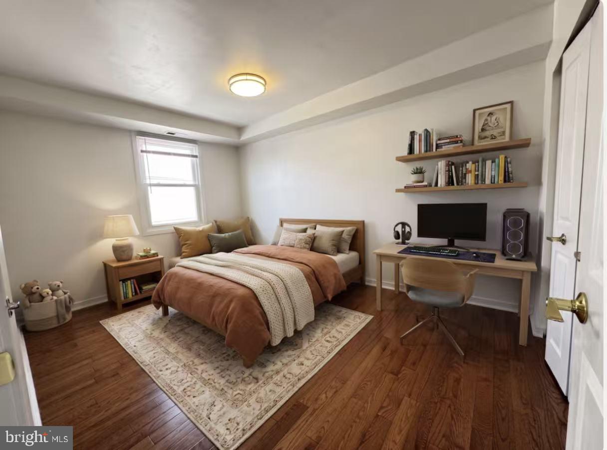 304 North 8th Street Philadelphia, PA 19123 - Photo 3 of 16 a spacious bedroom with a bed and a window