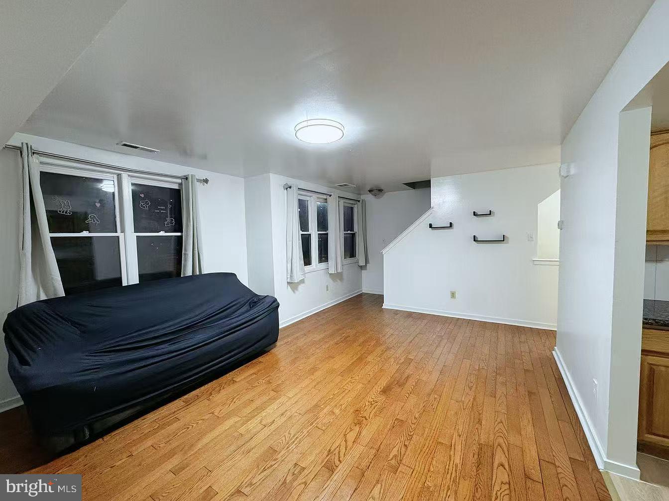 304 North 8th Street Philadelphia, PA 19123 - Photo 6 of 16 a spacious bedroom with a bed and window