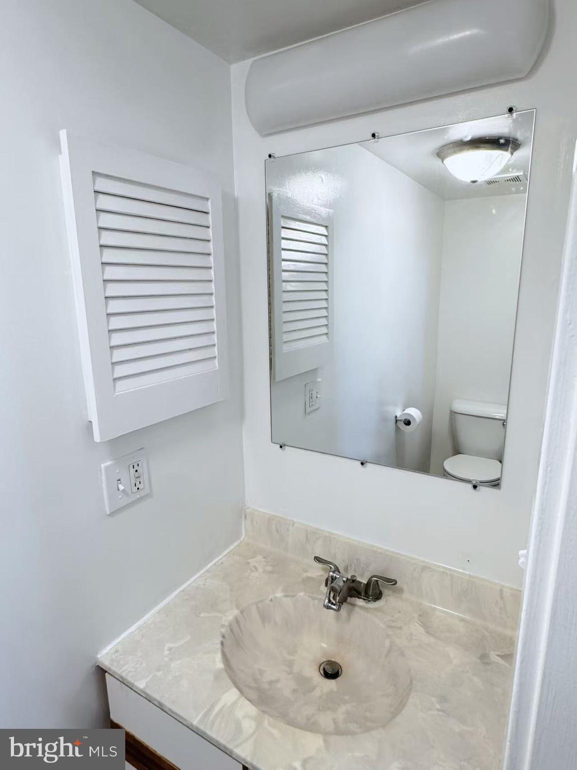 304 North 8th Street Philadelphia, PA 19123 - Photo 9 of 16 a bathroom with a sink and a mirror