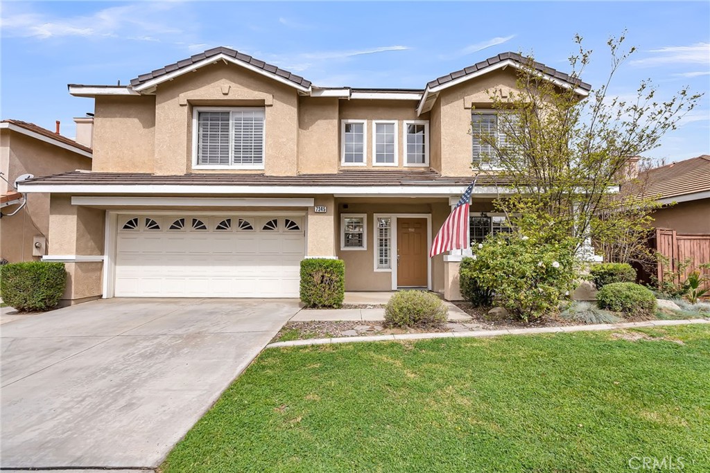 7345 Ayers Rock Road Riverside, CA 92508 - Photo 1 of 1 a front view of a house with a yard and garage