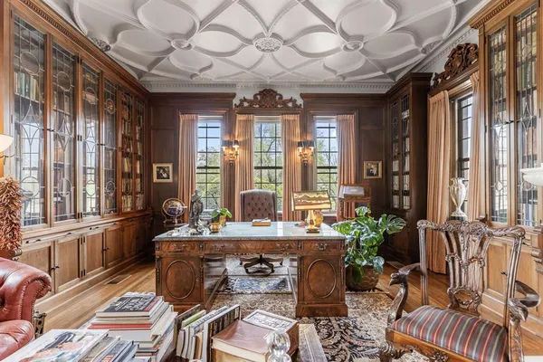 a dining room with a table and chairs